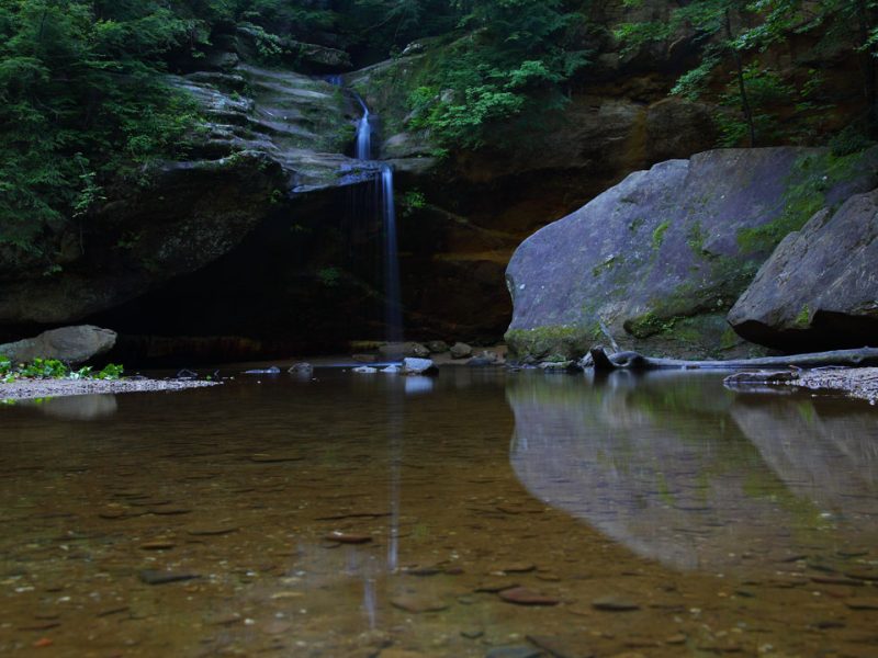 Photo of Old Man’s Cave reflection in water.